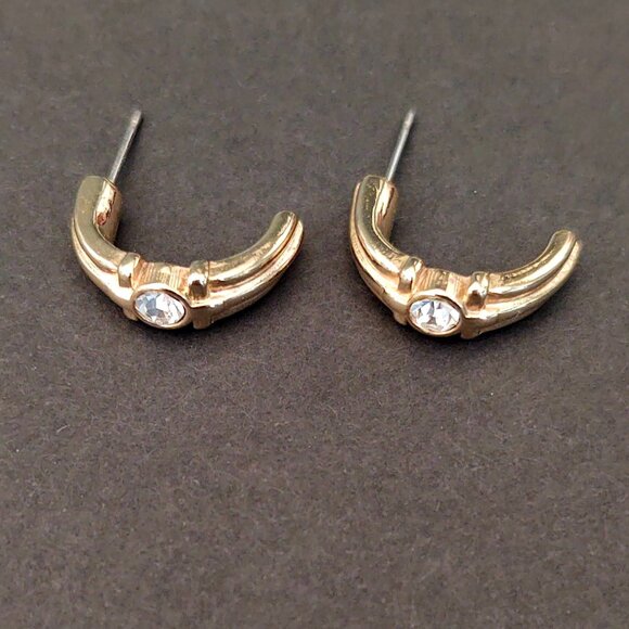 Curved gold tone earrings with faux diamond centers - Picture 7 of 8